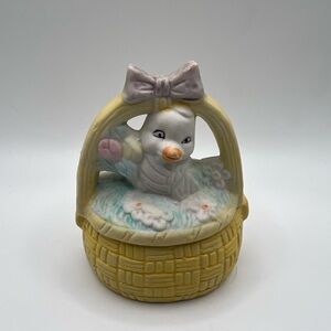 Ceramic trinket box shaped like an Easter basket, featuring a chick & candle